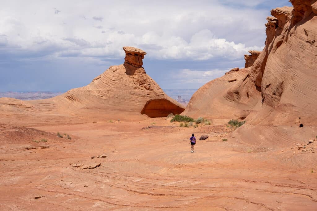 woman hiking on desert rock in Page Arizona
