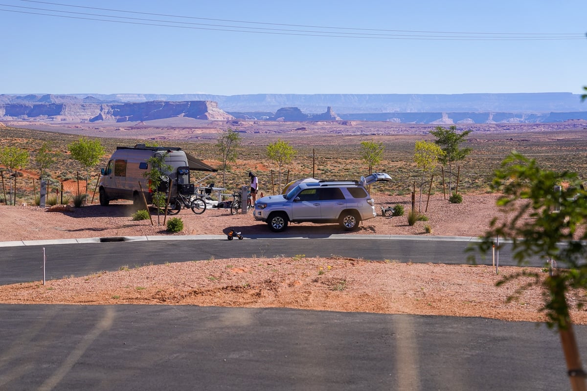 Sprinter van and 4runner parked at campsite at Roam Horseshoe Bend in Page Arizona with desert view in the background