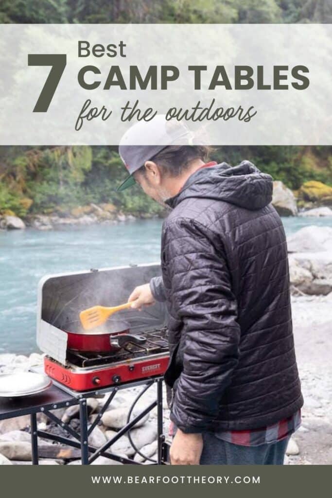 pinterest image of man cooking on camp table next to river. Text says "7 best camp table for the outdoors"