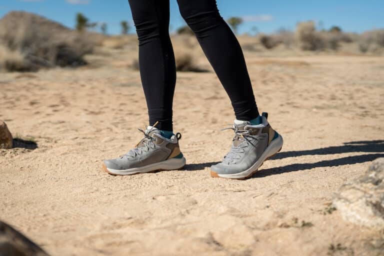 The Oboz Cottonwood mid waterproof hiking boots in the color Drizzle on a trail in Joshua Tree National Park