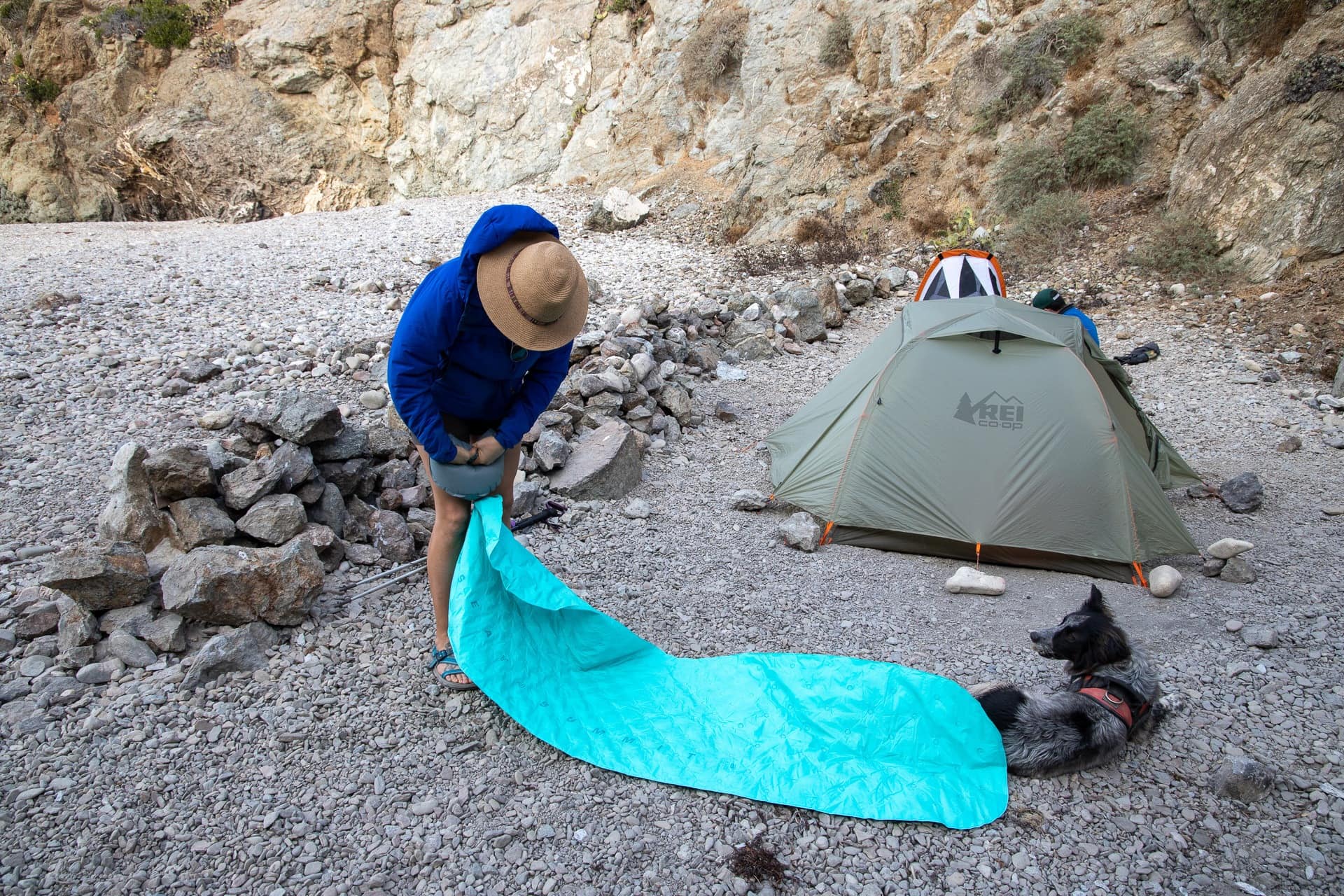 Kristen Bor inflating a sleeping pad with an integrated pump on the Trans-Catalina Trail in California