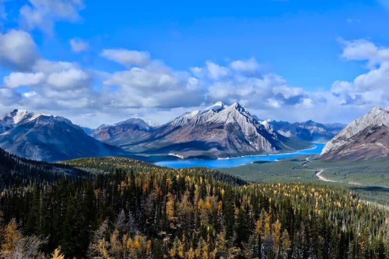 Beautiful view out over Canadian Rockies and alpine lake from trail