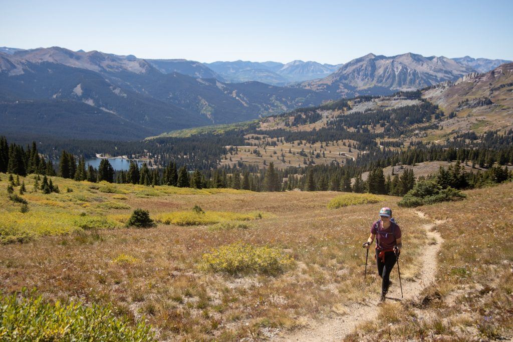Woman hiking on a dry trail in fall in Colorado