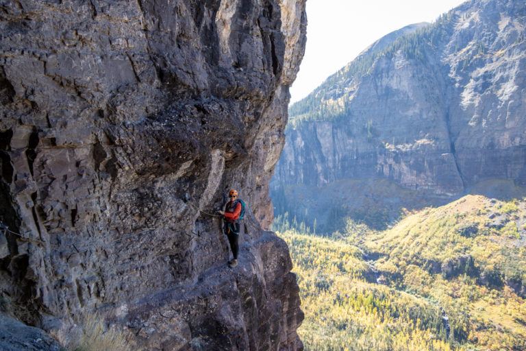 The Telluride Via Ferrata is a fun, thrilling mix of climbing & hiking where you use special equipment to traverse a steep cliff. Plan your trip with these tips.