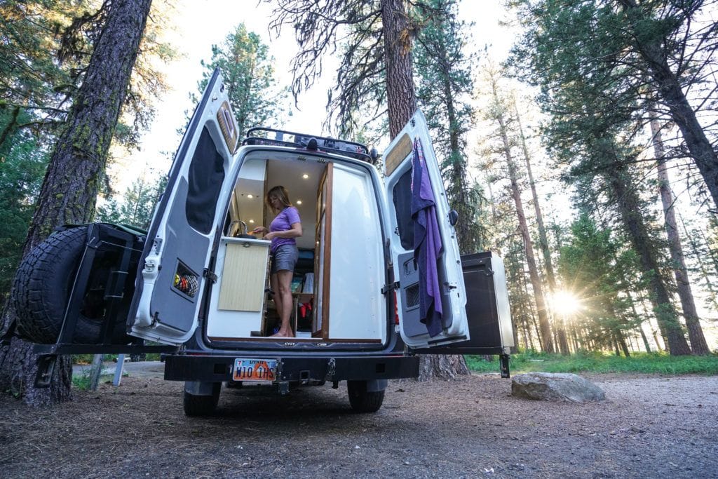 My favorite compact kitchen essentials for cooking in a camper van that don't rattle, break, or take up too much storage space in your van.