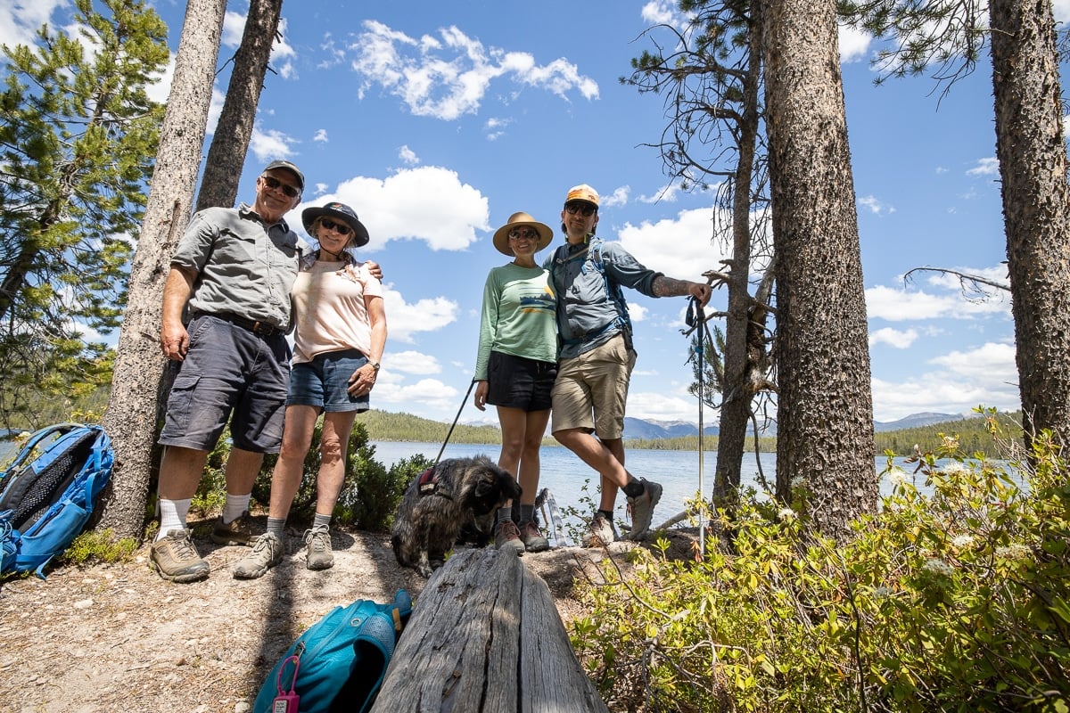 4 people standing next to a lake in Stanley Idaho