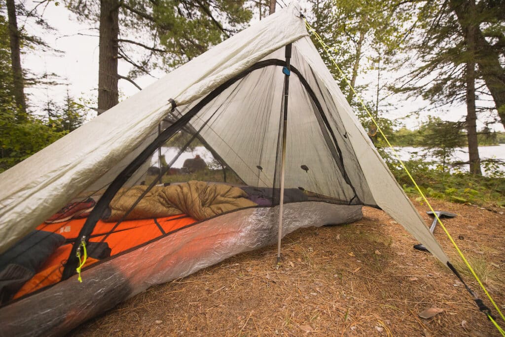 Z packs Triplex Trnt set up on the shores of a lake in Minnesota's Boundary Waters