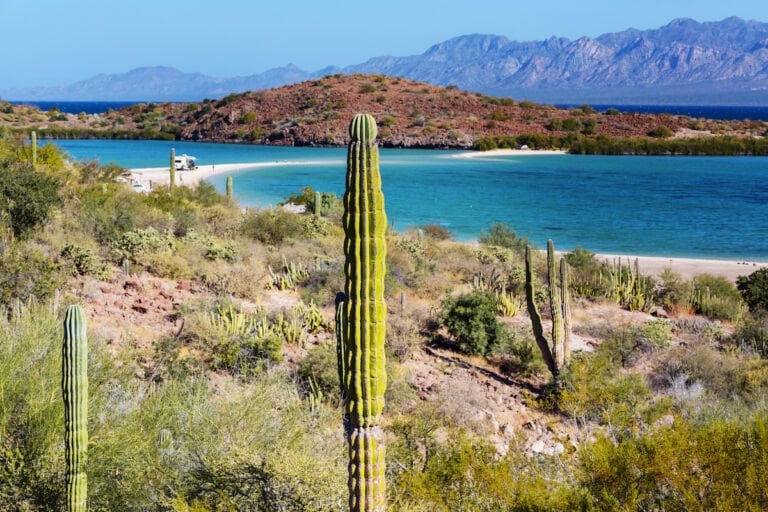 El Requeson in Baja California Sur from above. A white strip of beach with turquoise water and cacti