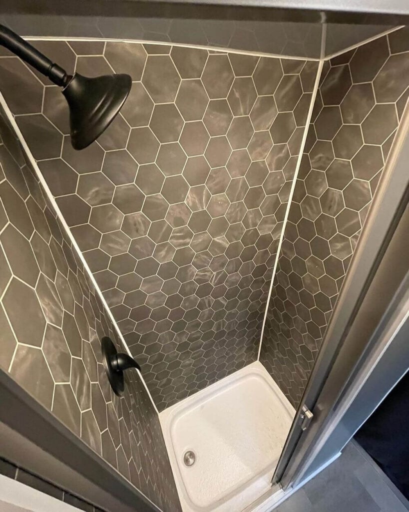 Recirculating shower in camper van shower by @thetriointransit