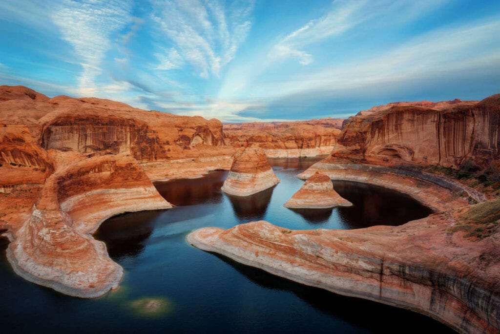 Landscape view out over winding river through Reflection Canyon in red rock country of Utah