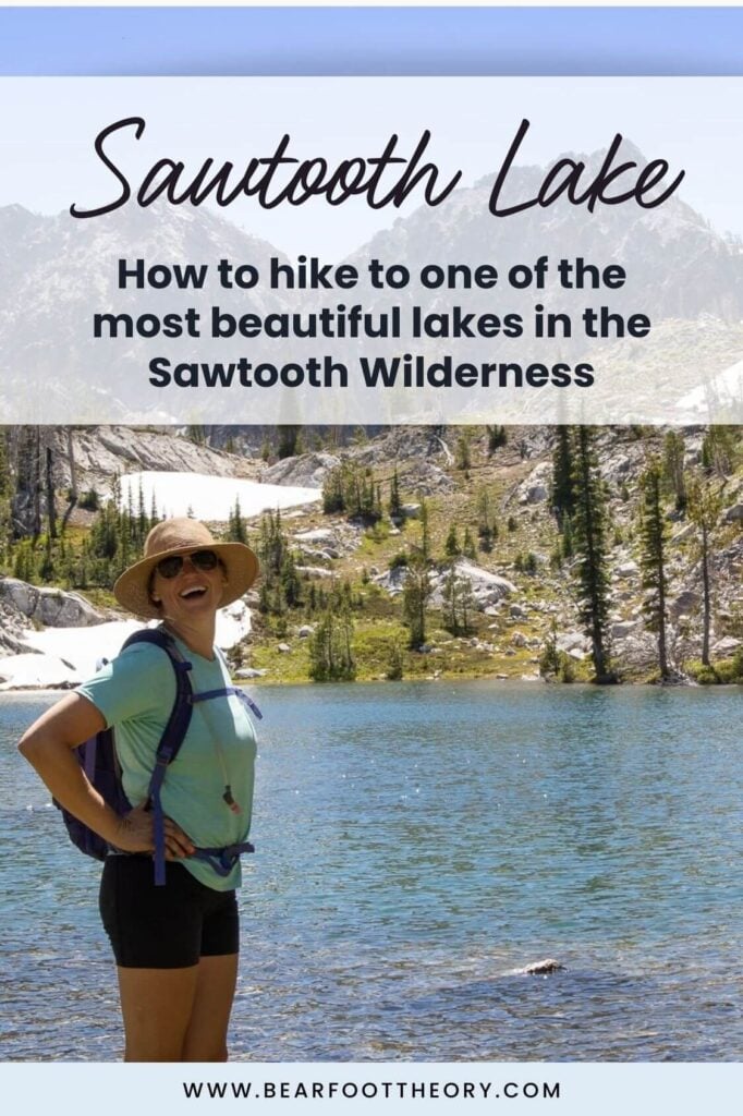 Pinterest image of woman standing next to clear alpine lake. Text says "Sawtooth Lake: How to hike to one of the most beautiful lakes in the Sawtooth Wilderness"