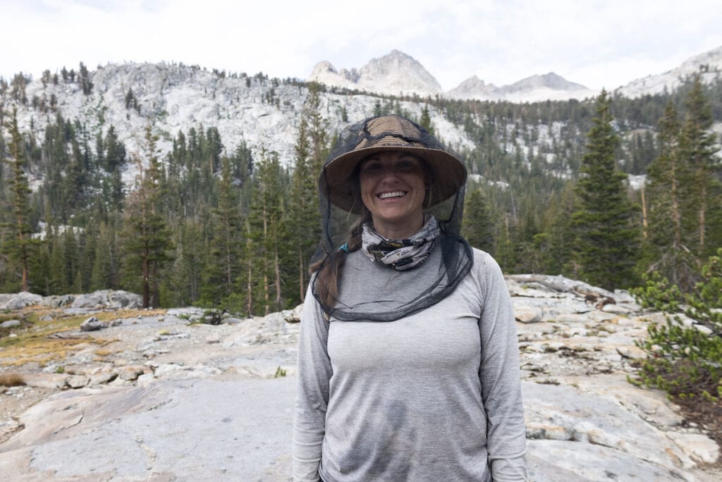 Kristen wearing a bug net backpacking in Kings Canyon National Park // The ultimate guide to gifts for outdoor lovers with ideas for hikers, backpackers, campers, travelers, skiers, outdoor pets, & more.