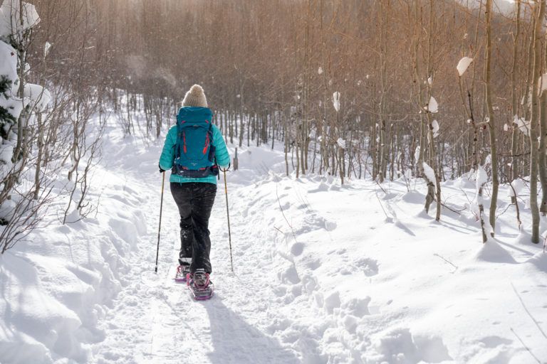 Learn how to snowshoe with our snowshoeing 101 guide. Get tips on how to find trails, what to wear, gear, important safety tips, and more.