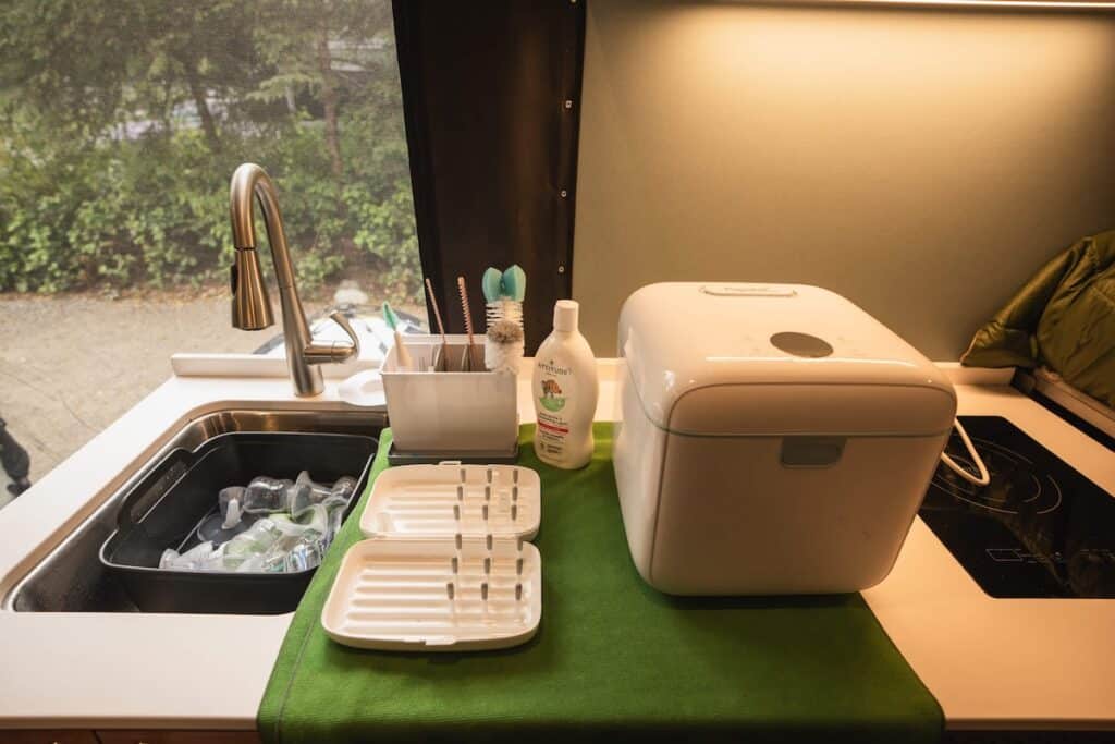Baby bottle washing and sterilizing station set up in Sprinter Van