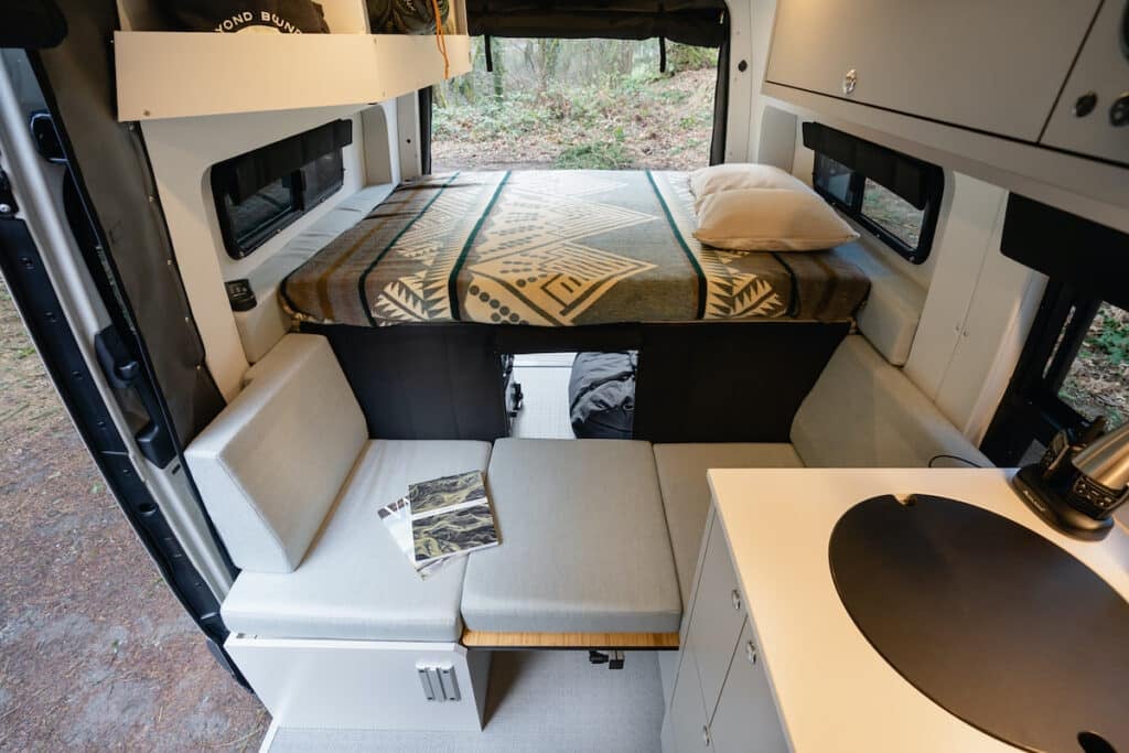 the interior of a custom Outside Van Sprinter Van conversion with Flares installed