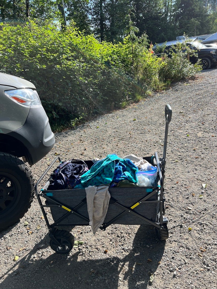 a beach wagon at a campsite full of laundry