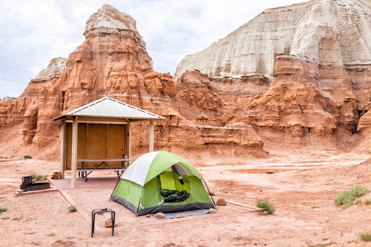 A green tent at a designated campsite in Goblin Valley State Park campground