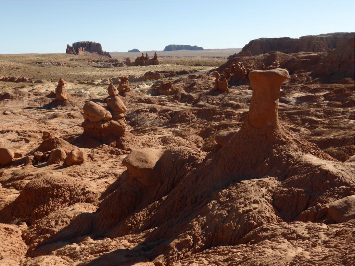 View of the orange hoodoo rock formations along Entrada Canyon trail in Goblin Valley State Park in Utah