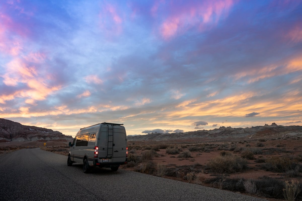 Sprinter Van at sunset on a road near Goblin Valley State Park in Utah